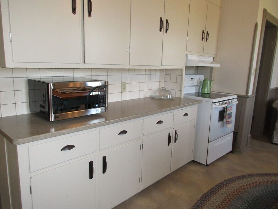 Functional kitchen has new counters and appliances.