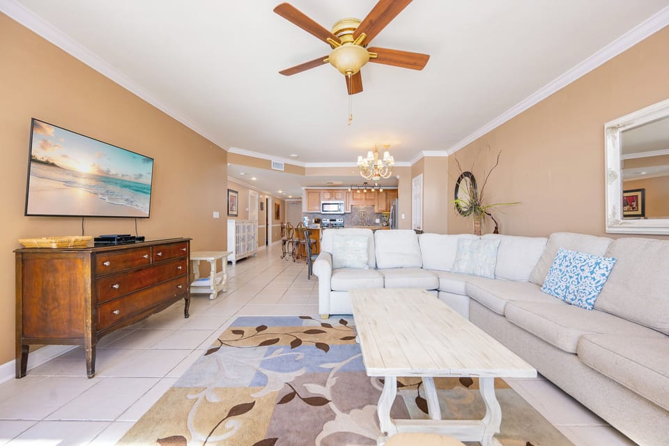 Soft colors invite you to unwind in the living room while the TV plays your favorite shows effortlessly