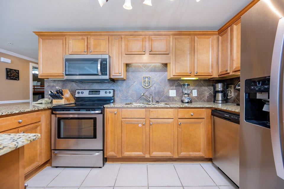 Smooth granite counters invite you to prepare fresh meals and enjoy time together in the kitchen