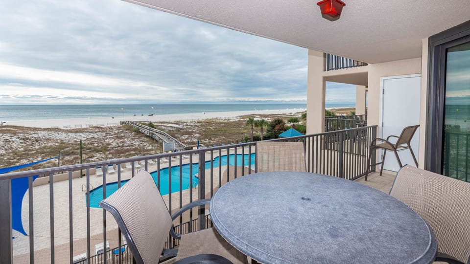 Enjoy your morning coffee on your beachfront balcony while taking in views of the pool and the coastline