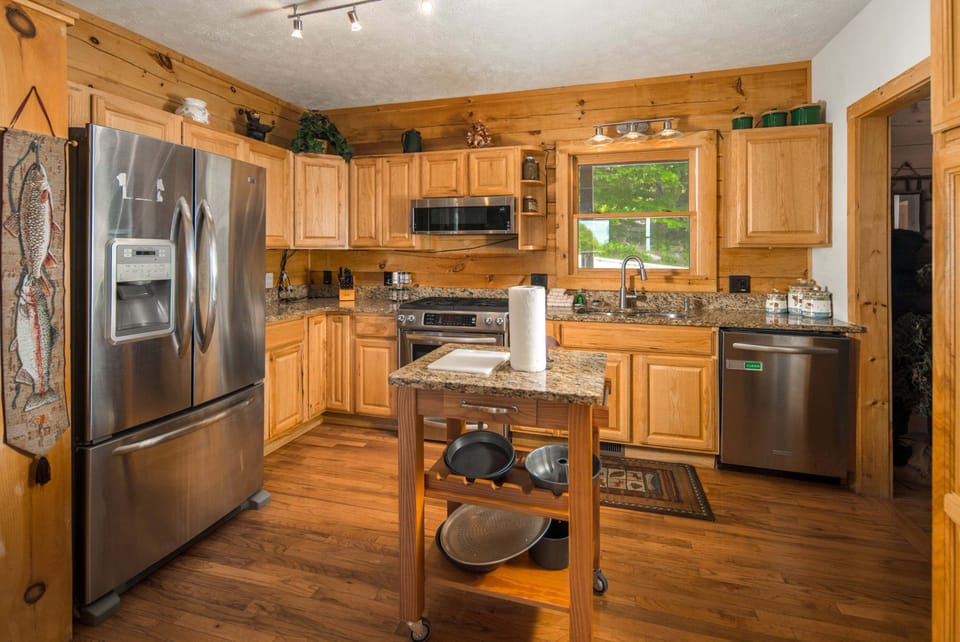 Spacious kitchen with modern appliances, granite countertops, and ample cabinet space