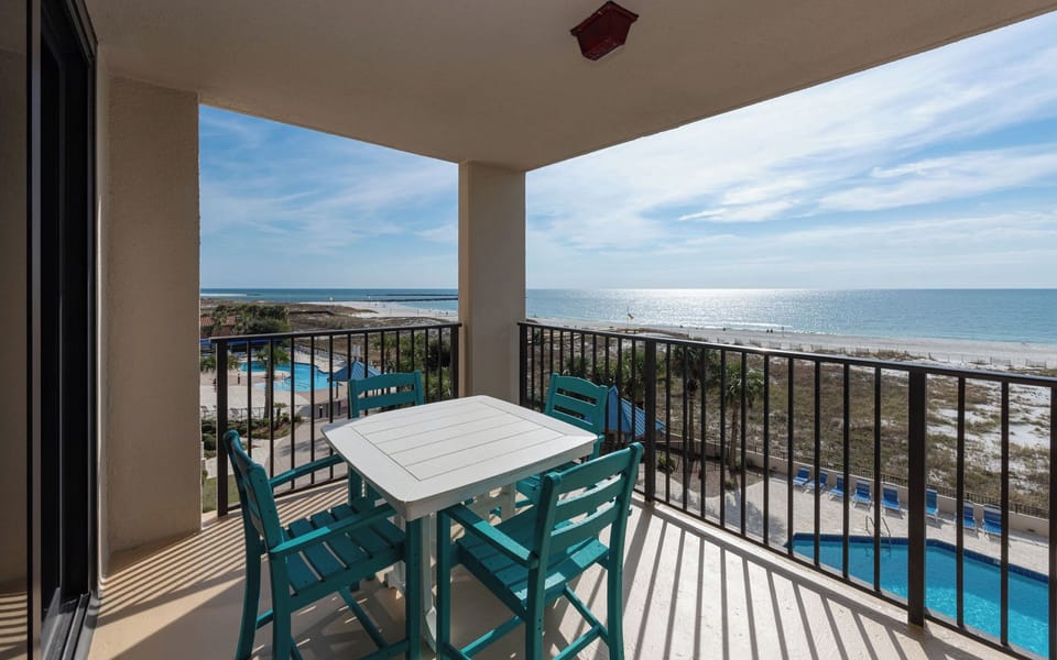 Enjoy meals or drinks while taking in the serene views of the coast and pool area