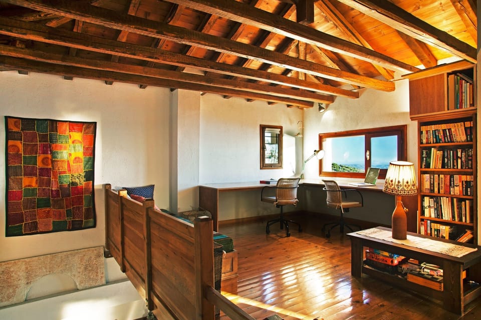 The office space has a sofa bed