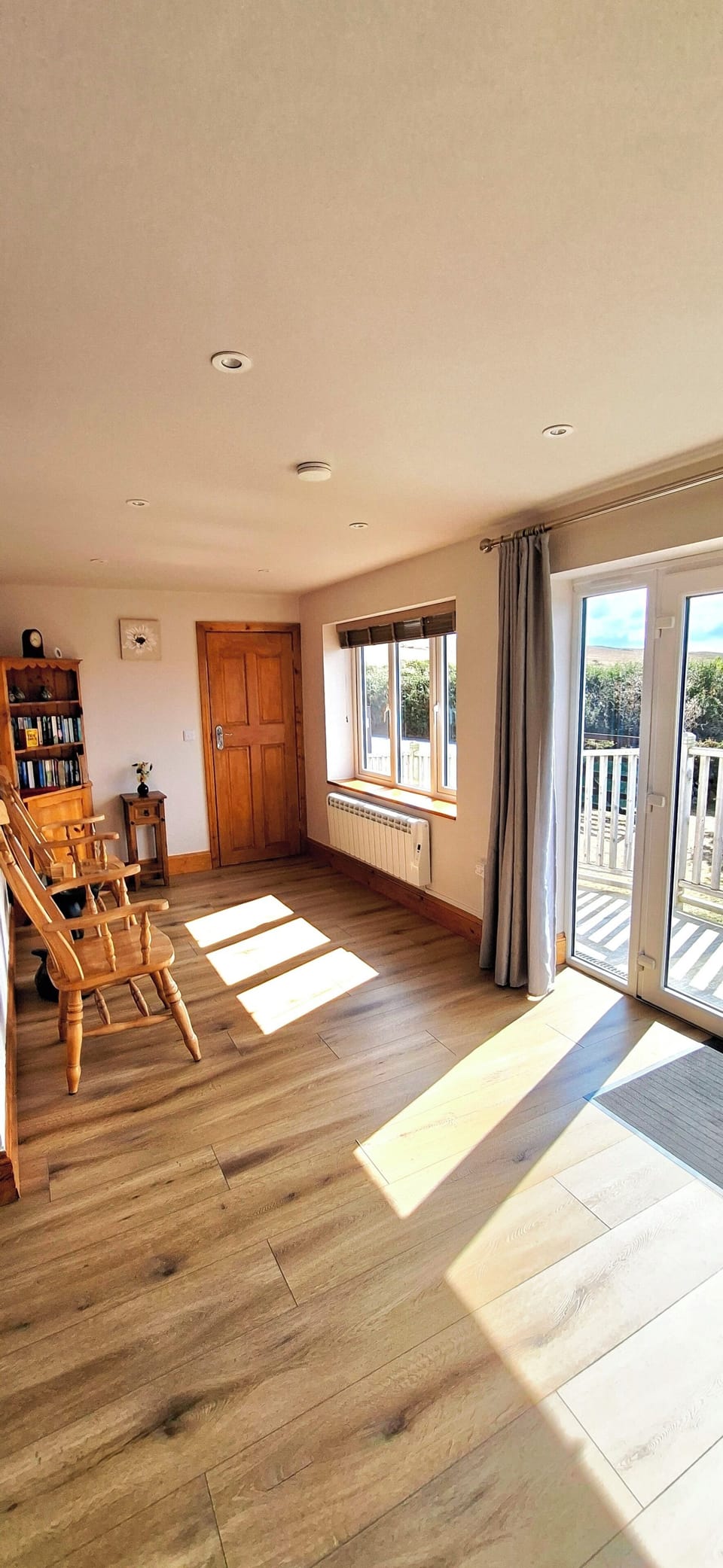 Sunroom with views across garden and countryside.