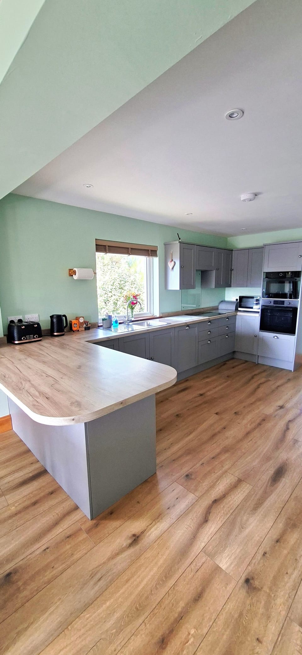 Large open-plan kitchen ideal for cooking, dining, and socialising together.