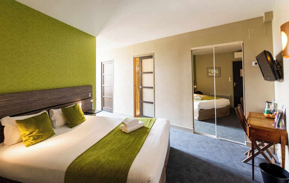 Suite, 2 Bedrooms | Desk, soundproofing, iron/ironing board, free WiFi