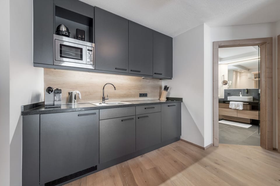Superior Suite, 2 Bedrooms | Private kitchenette | Full-size fridge, microwave, stovetop, dishwasher