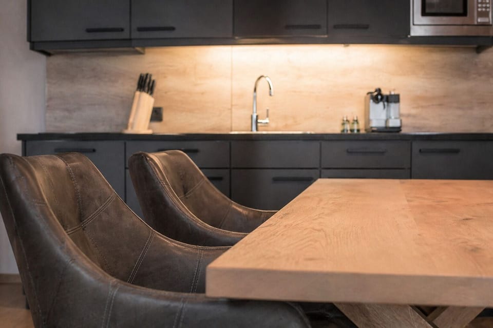 Deluxe Suite, 3 Bedrooms | Private kitchen | Full-size fridge, microwave, stovetop, dishwasher