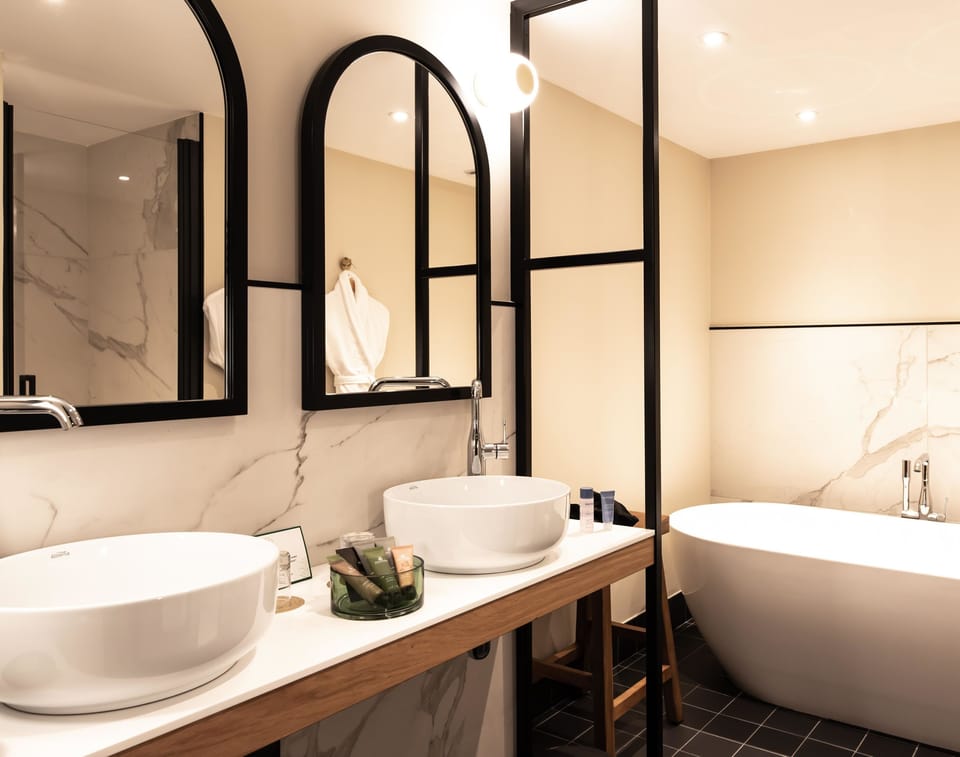 Designer toiletries, hair dryer, bathrobes, slippers