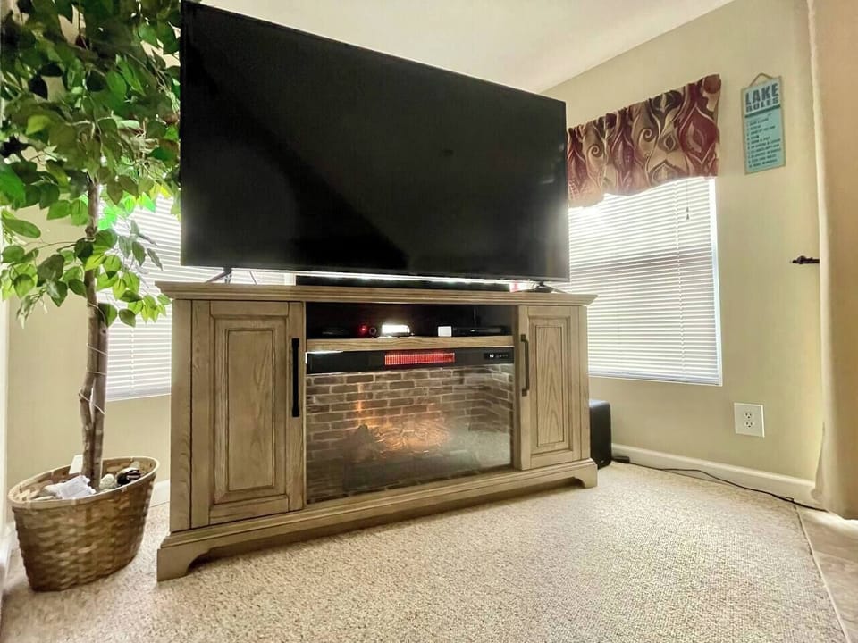70” smart TV with cable TV, DVD player, and electric fireplace. Carpet has been removed, and all new flooring has been installed March 2026.