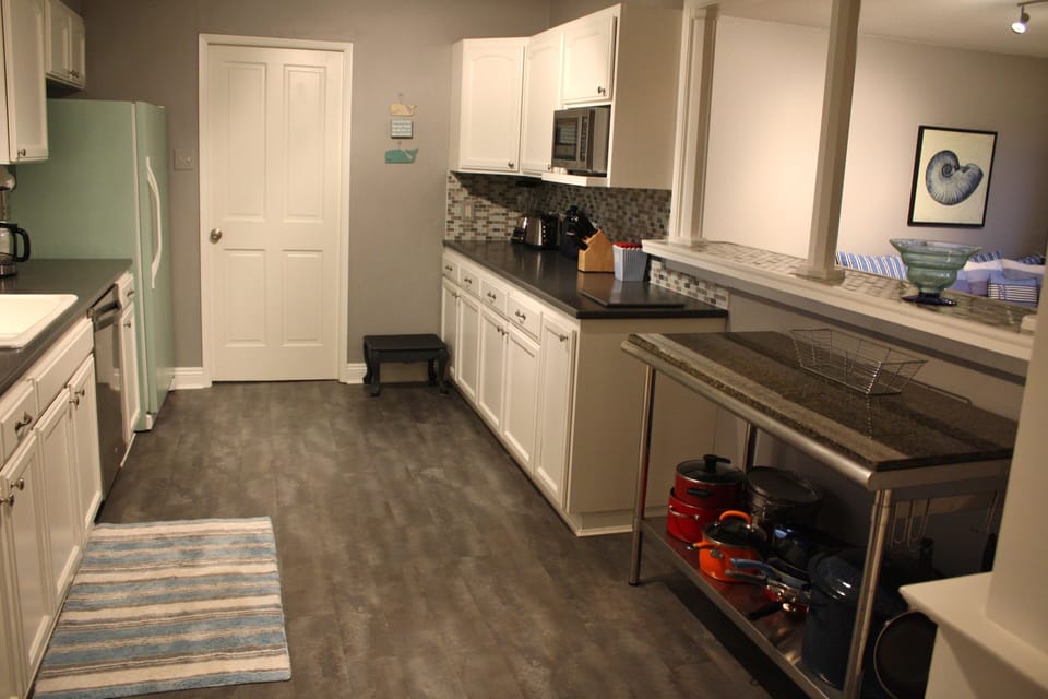 Kitchen view from other end, bar & great room on right.  Tons of counter space!