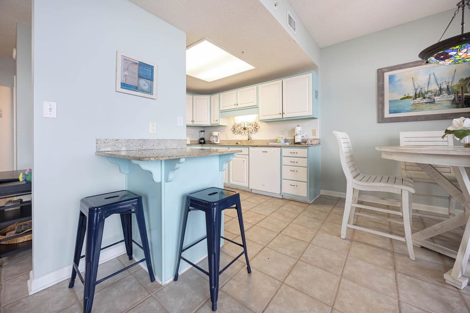 Gather around the charming dining table or enjoy a casual meal at the bar with comfortable seating