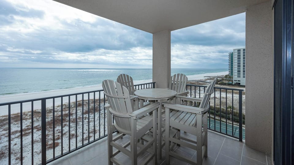 Enjoy meals or drinks at the high-top table while taking in the tranquil water views from your balcony