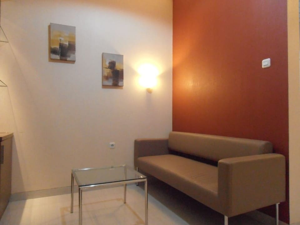 Superior Double Room | Living room | Flat-screen TV