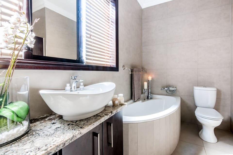 Deluxe Room (Quadruple) | Bathroom | Hair dryer, towels, soap, shampoo