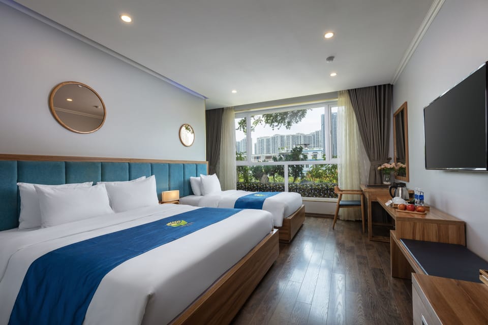 Family Triple Room | Free minibar items, in-room safe, desk, blackout drapes