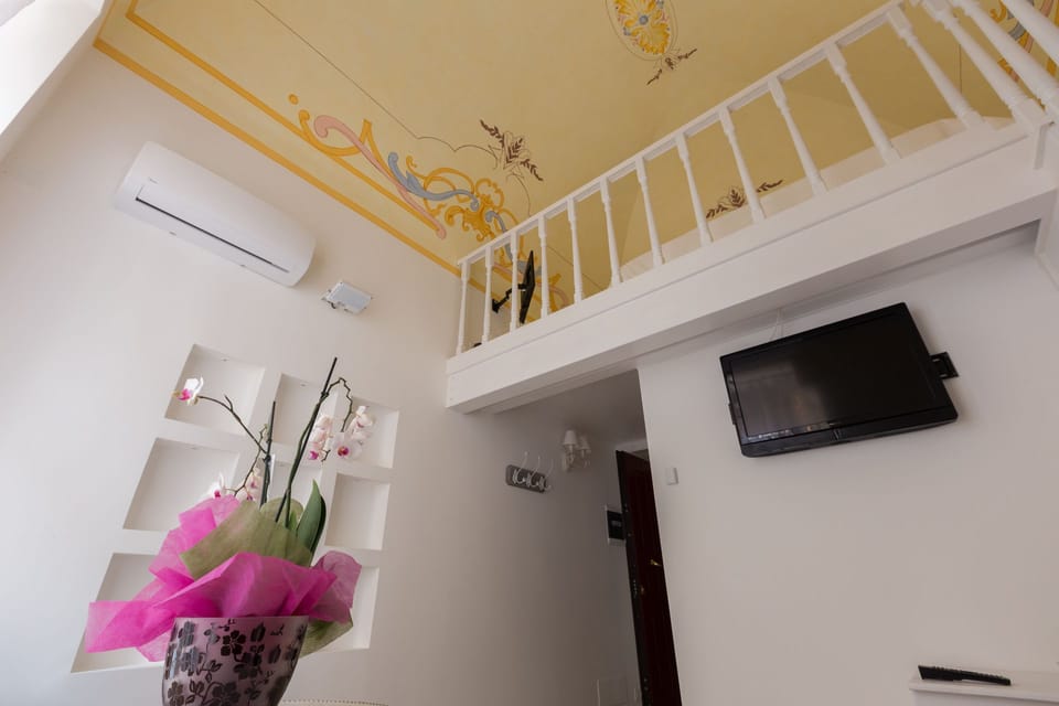 Junior Suite, Terrace | Living area | TV