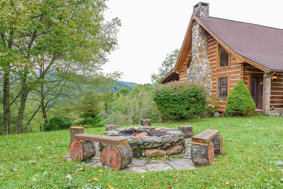 Outdoor Fire Pit with Rustic Log Seats and Grill Grates for BBQ-ing