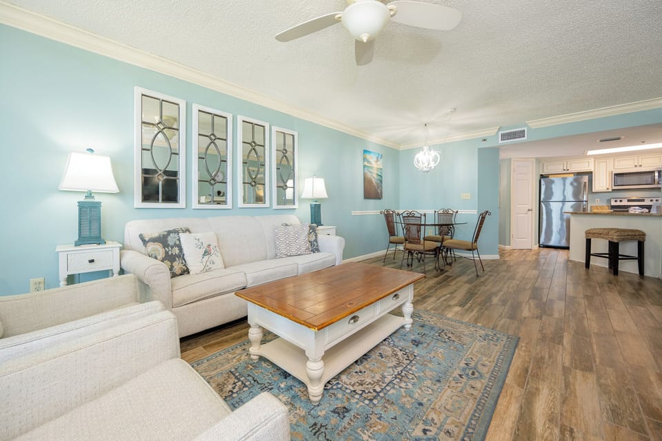 Relax in the inviting living area with a queen sofa sleeper, stylish decor, and a dining space for shared meals