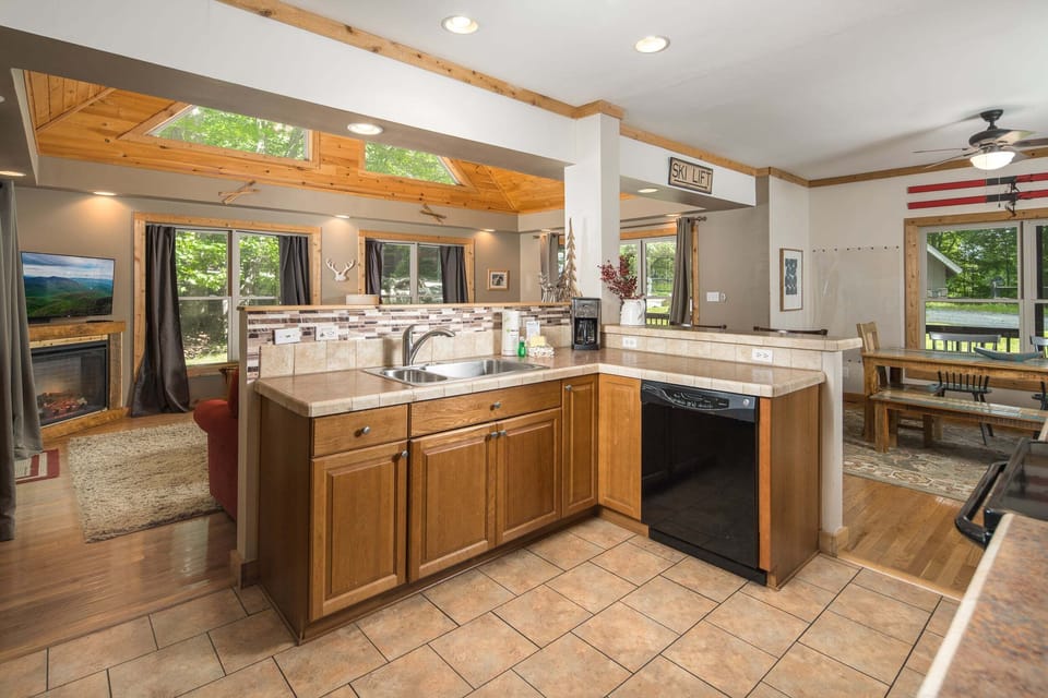 The fully equipped kitchen features ample counter space, modern appliances, and an open layout for easy entertaining