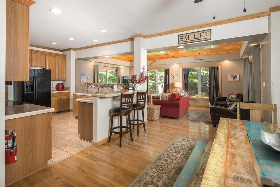 The open-concept layout keeps the kitchen, dining, and living spaces connected