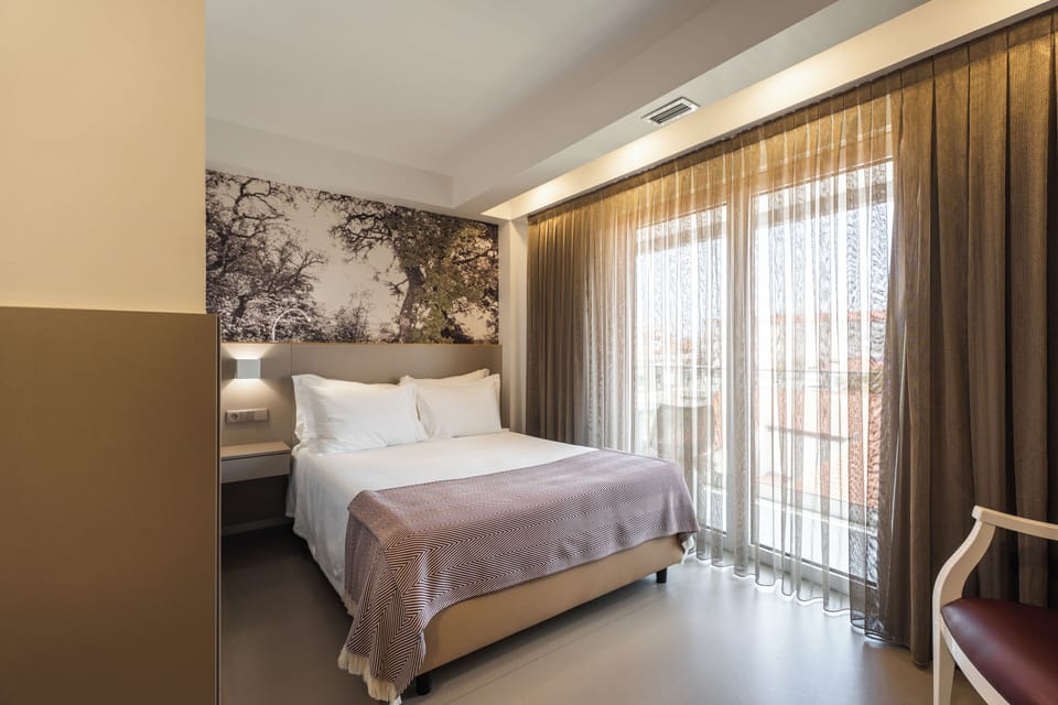 Standard Double Room, Balcony | In-room safe, individually decorated, individually furnished, desk