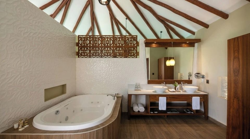 Separate tub and shower, rainfall showerhead, free toiletries