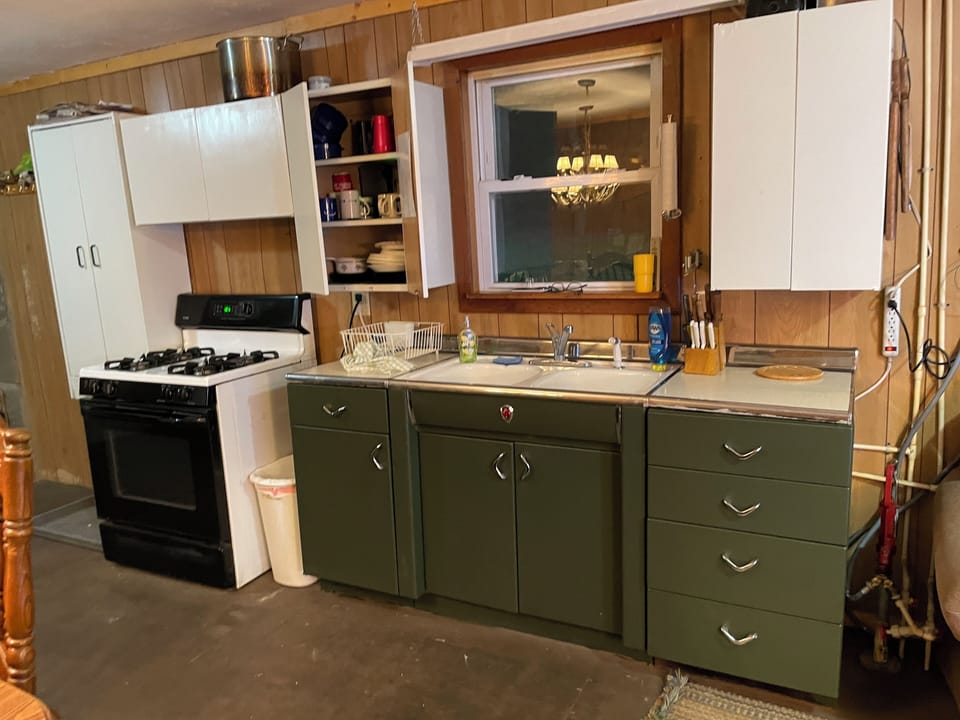 Full kitchen with microwave and coffee pot