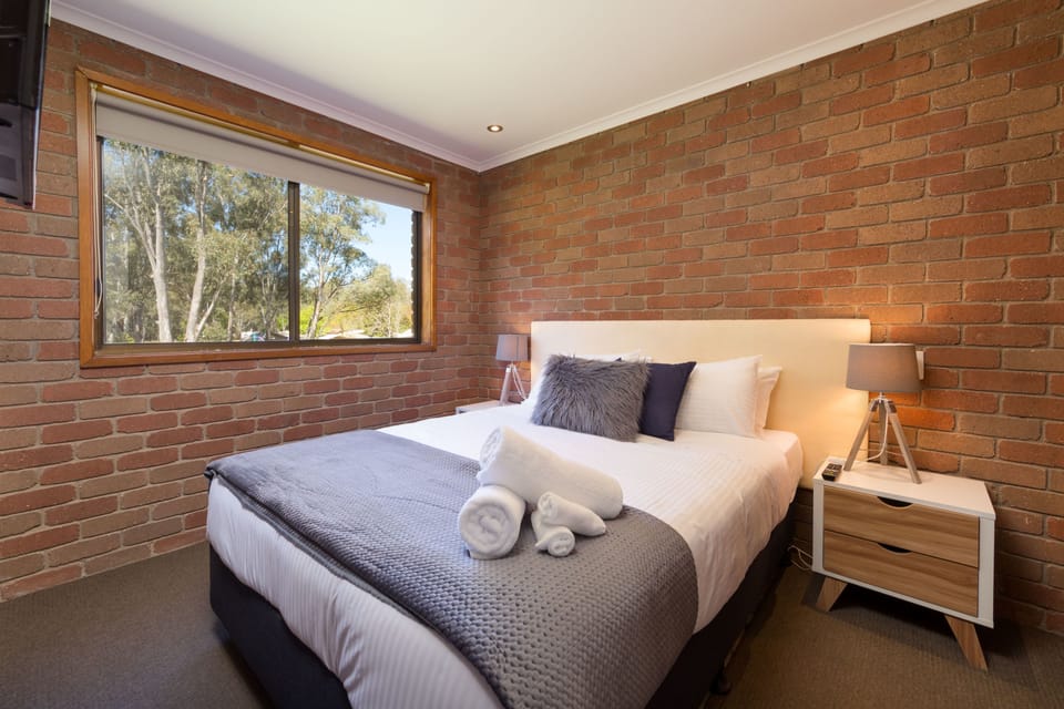 Family Apartment, 2 Bedrooms | 1 bedroom, blackout drapes, iron/ironing board, free cribs/infant beds