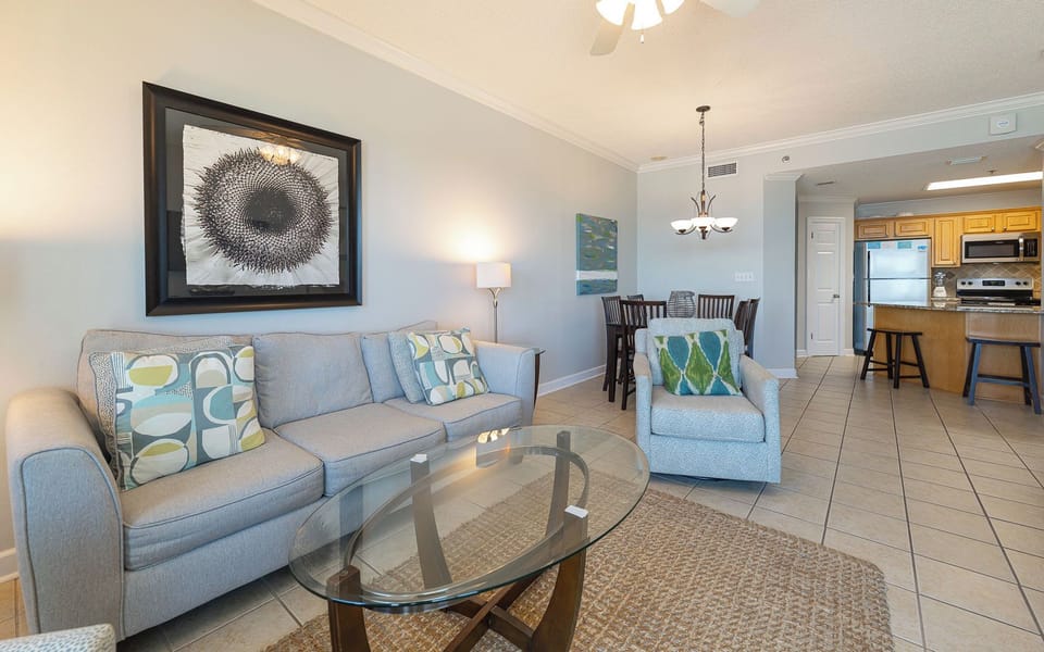 Gather in this living space, sharing stories and laughter while enjoying the warmth of your coastal getaway