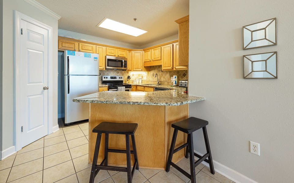 Craft delicious meals in the kitchen, enjoying the ample counter space and seating for family gatherings