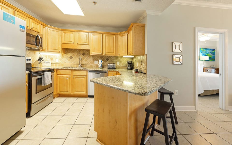Savor moments at the breakfast bar, sipping coffee and enjoying laughs with family in this welcoming kitchen space