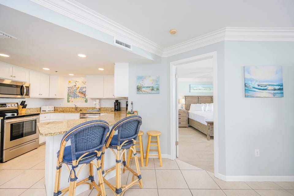 Soft light spills through the guest suite while you unwind after preparing fresh meals at the breakfast bar in the kitchen