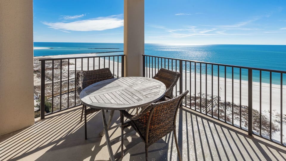 Enjoy meals or drinks on the balcony overlooking the tranquil waters and shoreline