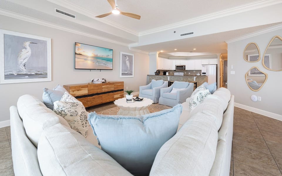 Relax in the plush seating, enjoying family movie nights on the big screen while soaking in the coastal vibe
