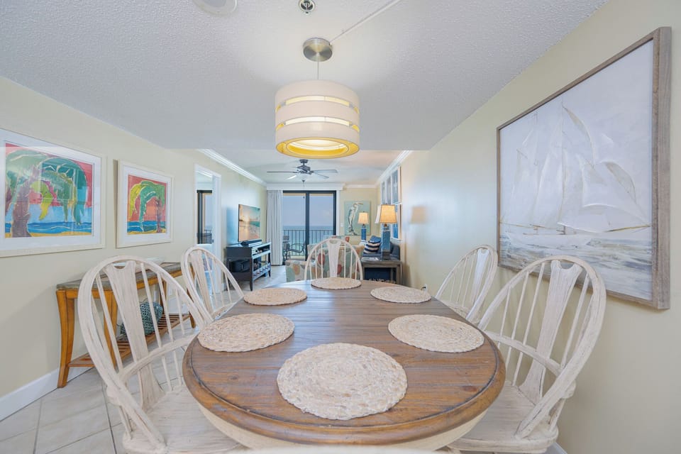 Gather around the charming dining table, sharing stories and laughter as you savor the beach vibe of your getaway