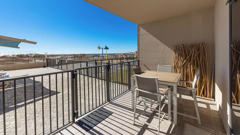 Savor meals at the outdoor dining set while enjoying views of the beach and nearby splash park
