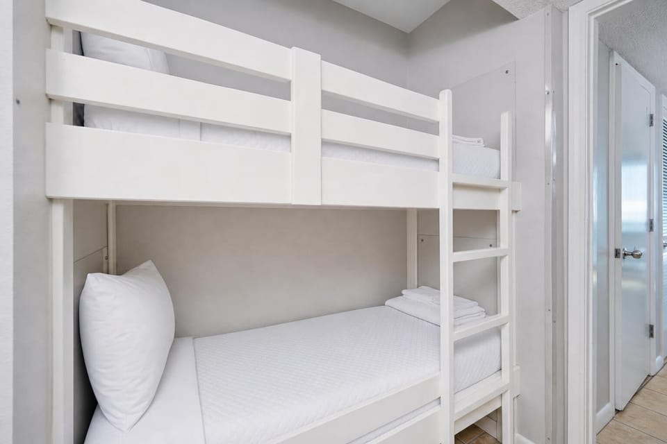 Cozy bunk beds provide a fun sleeping option for kids, with easy access to the inviting living space