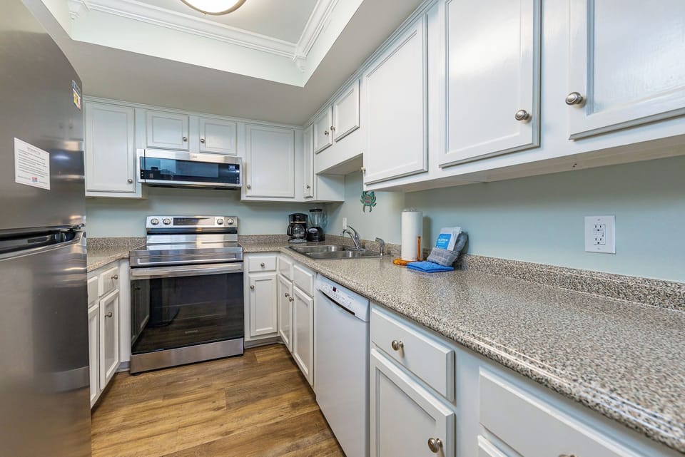 Craft your favorite meals in this cozy kitchen, complete with modern appliances and a sleek cabinetry