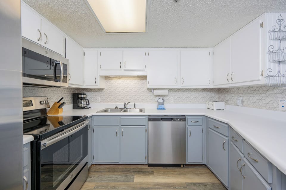 Smooth countertops and a coffee maker set the stage for your family's kitchen moments together