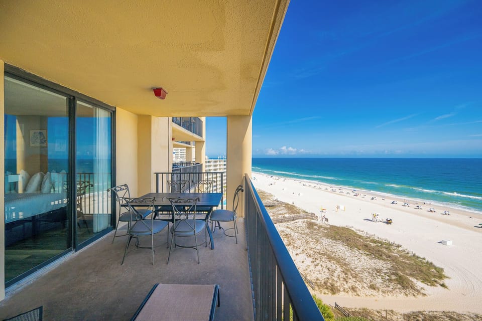 Your balcony invites quiet mornings with gulf breezes and expansive views of the white beach shore