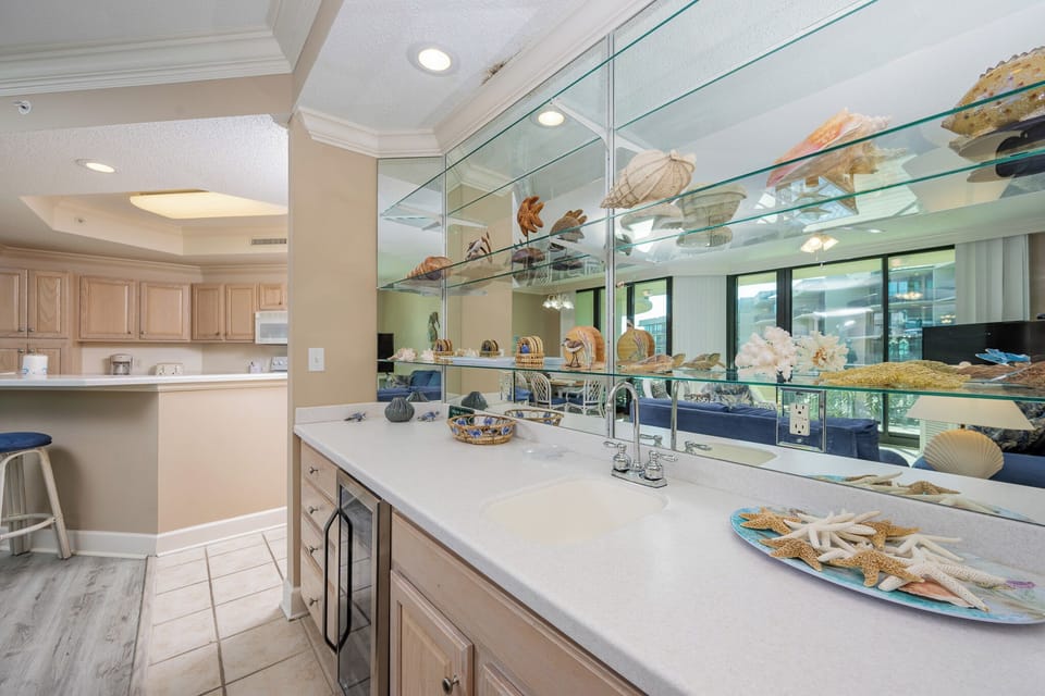 Delight in exploring the sleek wet bar, perfect for mixing refreshing drinks while enjoying time with loved ones