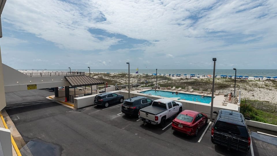 Enjoy views of the beachfront and pool area from this inviting space, perfect for relaxation and fun