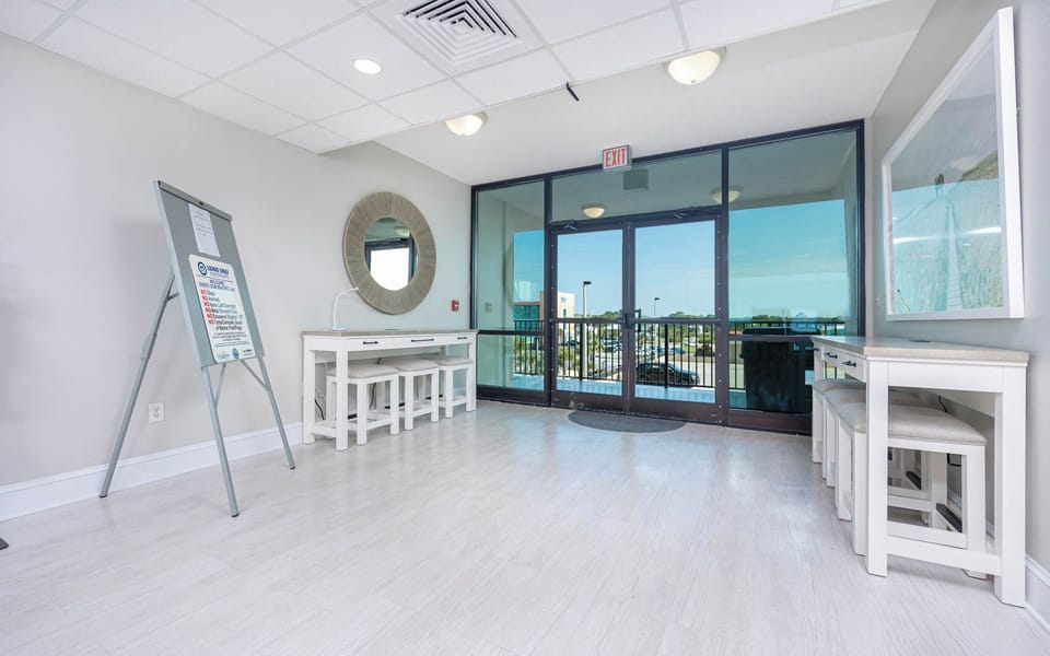 Step into this welcoming lobby with a view of the beach and comfortable seating for a relaxing start to your getaway
