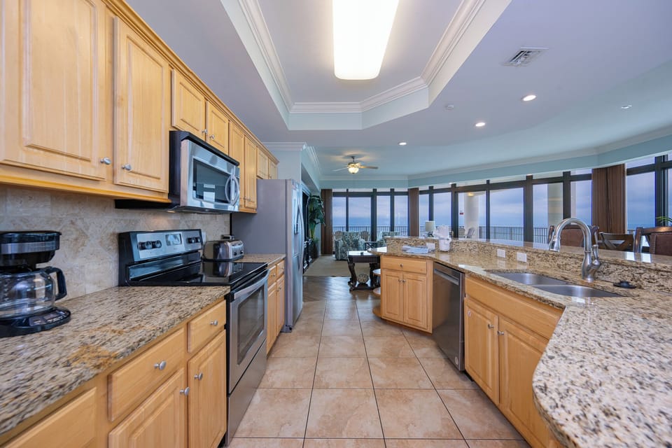 Create delicious meals at the granite counter, while taking in sweeping coastal views from your kitchen