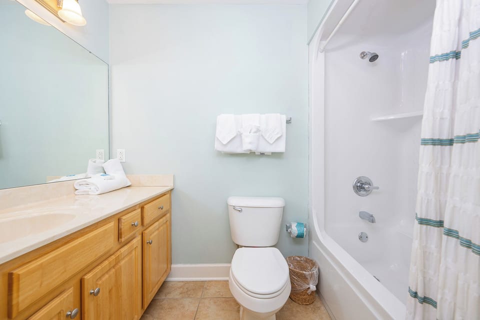 Enjoy in a refreshing shower in the guest bath, surrounded by soft towels, ready to rejuvenate after a fun day at the beach
