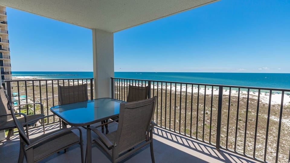 Balcony seating offers a serene view of the gulf and beach, perfect for enjoying morning coffee with the sunrise