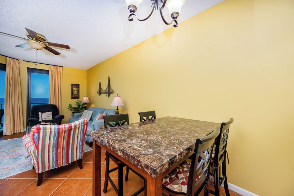 Dine at the stylish table while enjoying the vibrant decor and inviting atmosphere of your living space