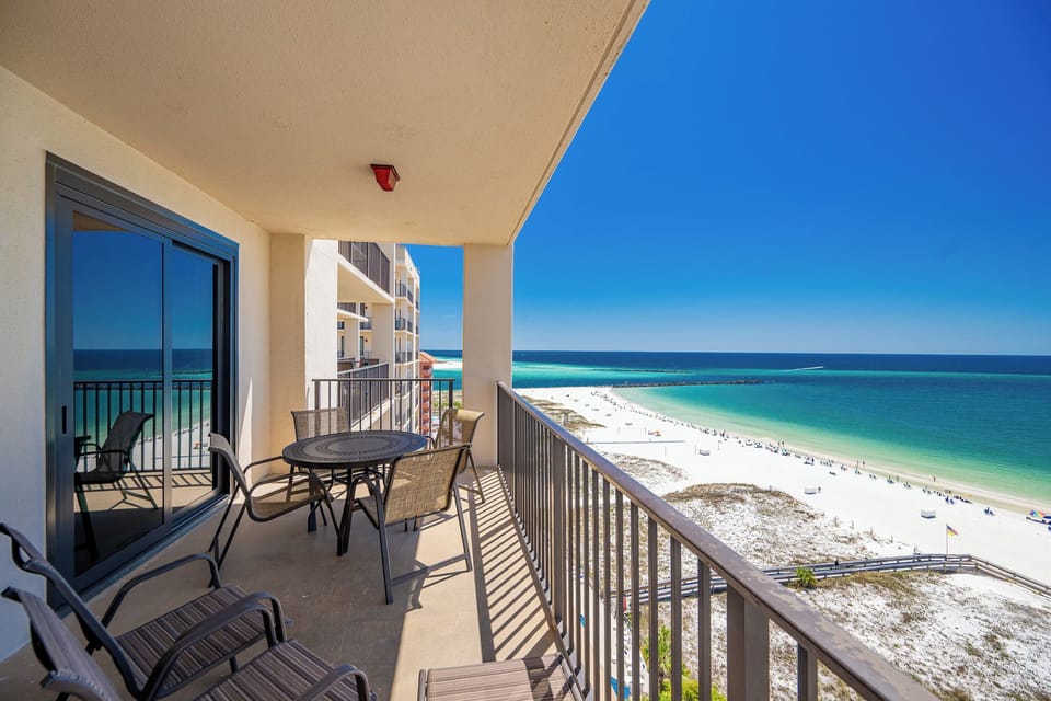 Relax on the balcony enjoying views of the beautiful beach and tranquil waters