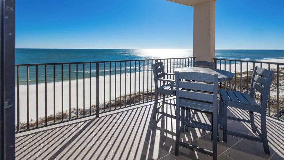 Enjoy meals or drinks at the outdoor table while taking in the stunning beach views and fresh air